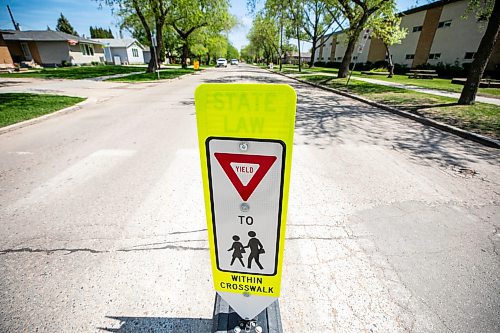 MIKAELA MACKENZIE / FREE PRESS
	
New in-street crosswalk signage in front of Frontenac School on Thursday, May 28, 2026.

For Maggie story.
Free Press 2026