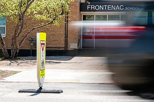 MIKAELA MACKENZIE / FREE PRESS
	
New in-street crosswalk signage in front of Frontenac School on Thursday, May 28, 2026.

For Maggie story.
Free Press 2026