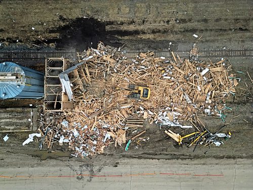 15042026
The grain elevator in Austin, Manitoba, built in 1951, is demolished by members of Pine Creek Hutterite Colony on Wednesday as a crowd looks on. The colony bought the elevator from Viterra in 2003.   (Tim Smith/The Brandon Sun)