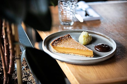 MIKAELA MACKENZIE / FREE PRESS
	
A custard tart with apple molasse and blackened apple puree at Gather restaurant on Wednesday, May 27, 2026. 

For AV story.
Free Press 2026