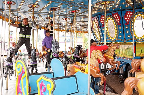01062026
Midway workers polish the carousel ride in preparation for the 2026 Manitoba Summer Fair at the Keystone Centre grounds on Monday. The fair opens Wednesday and runs until Sunday. 
(Tim Smith/The Brandon Sun)