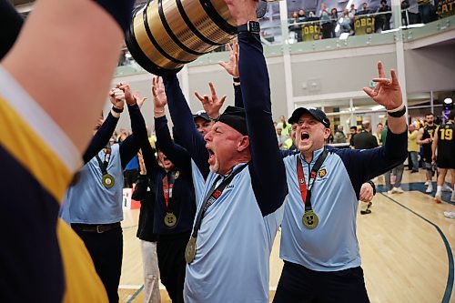 Grant Wilson hoists the Tantramar Trophy after capturing BU's first U Sports men's volleyball championship on home court in 2025. (Tim Smith/The Brandon Sun)