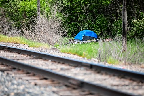 MIKAELA MACKENZIE / FREE PRESS
	
A tent near a rail line along Omands Creek on Wednesday, June 3, 2026. Two city councillors want to work with railway operators on encampments so the city can enforce its bylaw on rail property.

For Scott B story.
Free Press 2026