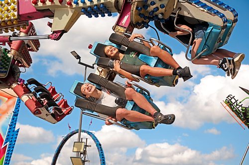 03062026
Smiling fair-goers ride the re-mix midway ride on the opening day of the Manitoba Summer Fair at the Keystone Centre grounds on Wednesday. The fair runs until Sunday. 
(Tim Smith/The Brandon Sun)
