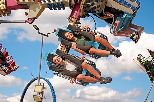 03062026
Smiling fair-goers ride the re-mix midway ride on the opening day of the Manitoba Summer Fair at the Keystone Centre grounds on Wednesday. The fair runs until Sunday. 
(Tim Smith/The Brandon Sun)
