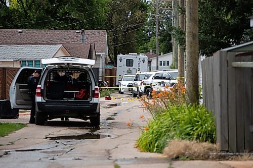 Daniel Crump / Winnipeg Free Press. Police are on the scene of an officer involved shooting in a lane behind Bernier Bay in Windsor Park. August 27, 2022.