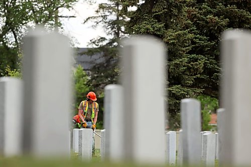 04062026
A worker trims grass at the Brandon Municipal Cemetery on a sunny Thursday afternoon.
(Tim Smith/The Brandon Sun)