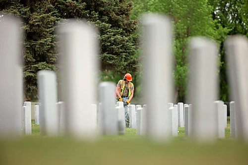04062026
A worker trims grass at the Brandon Municipal Cemetery on a sunny Thursday afternoon.
(Tim Smith/The Brandon Sun)