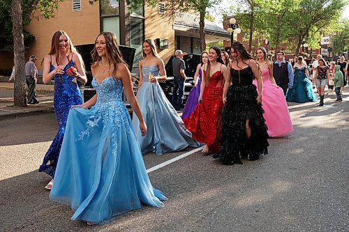 04062026
Upcoming high school graduates parade along Rosser Avenue in downtown Brandon decked out in their graduation attire to applause from visitors to the Brandon Downtown Grad Cruise Night on Thursday evening. The event was part of the monthly Brandon & Area Car Enthusiasts (BACE) and Downtown BIZ cruise night and celebrated the accomplishments of Brandon and area’s 2026 high school graduates.
(Tim Smith/The Brandon Sun)
