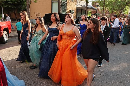 04062026
Upcoming high school graduates parade along Rosser Avenue in downtown Brandon decked out in their graduation attire to applause from visitors to the Brandon Downtown Grad Cruise Night on Thursday evening. The event was part of the monthly Brandon & Area Car Enthusiasts (BACE) and Downtown BIZ cruise night and celebrated the accomplishments of Brandon and area’s 2026 high school graduates.
(Tim Smith/The Brandon Sun)