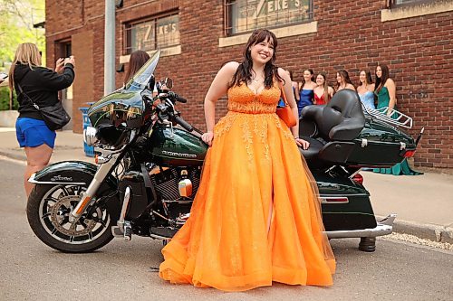 04062026
Natalie Wright of Vincent Massey High School has photos taken on a Harley Davidson motorcycle in her graduation dress during the Brandon Downtown Grad Cruise Night on Thursday evening. The event was part of the monthly Brandon & Area Car Enthusiasts (BACE) and Downtown BIZ cruise night and celebrated the accomplishments of Brandon and area’s 2026 high school graduates.
(Tim Smith/The Brandon Sun)