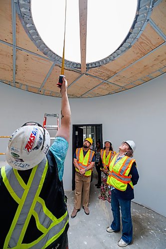 MIKE DEAL / FREE PRESS
(From left) James Campbell, site superintendent for Parkwest Projects Ltd, talks to Vince Barletta, CEO of Harvest Manitoba, Rachel Sansregret, CEO of the Winnipeg Indigenous Friendship Centre, and Rebecca Alty, Minister of Crown-Indigenous Relations, while on a tour of the construction site for the Asihcikan Project.
Rebecca Alty, Minister of Crown-Indigenous Relations, gets a tour of the Asihcikan Project at 567 Notre Dame Avenue before making an announcement regarding the start of the grocery benefit payments program.
The Asihcikan Project is a $14-million Indigenous-led community hub and grocery-style food bank in central Winnipeg. Located at 563-567 Notre Dame Avenue, the 30,000-square-foot space was created by the Ma Mawi Wi Chi Itata Centre and Harvest Manitoba.
Reporter: Morgan Modjeski
260605 - Friday, June 05, 2026.
