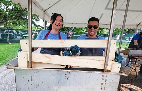 Ruth Bonneville  Free Press

LOCAL - bed-building

Blue Cross workers Karyl Grasparil and her husband Darryl Grasparil work together as they treat the freshly built headboards with a natural treatment during bed building event Friday. 
 
Volunteers with Manitoba Blue Cross work alongside volunteers from Sleep in Heavenly Peace in a live bed-building event to build and assemble 50 twin-sized beds for local children which marks the third year of Manitoba Blue Cross’s ongoing partnership with Sleep in Heavenly Peace. 

June 5th,,  2026
