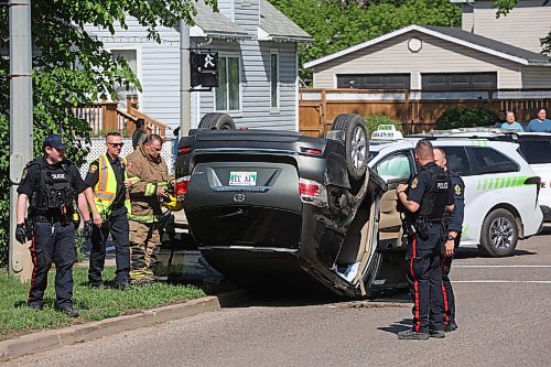 05062026
Brandon Fire & Emergency Services members and Brandon Police Service members respond to a two-vehicle collision that caused one of the vehicles to roll onto its roof at the corner of Victoria Avenue and 6th Street in Brandon late Friday afternoon. At least three people were treated for injuries related to the collision, which blocked intersection. (Tim Smith/The Brandon Sun)
