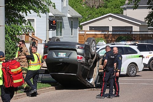 05062026
Brandon Fire & Emergency Services members and Brandon Police Service members respond to a two-vehicle collision that caused one of the vehicles to roll onto its roof at the corner of Victoria Avenue and 6th Street in Brandon late Friday afternoon. At least three people were treated for injuries related to the collision, which blocked intersection. (Tim Smith/The Brandon Sun)