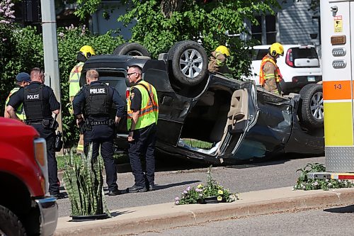05062026
Brandon Fire & Emergency Services members and Brandon Police Service members respond to a two-vehicle collision that caused one of the vehicles to roll onto its roof at the corner of Victoria Avenue and 6th Street in Brandon late Friday afternoon. At least three people were treated for injuries related to the collision, which blocked intersection. (Tim Smith/The Brandon Sun)