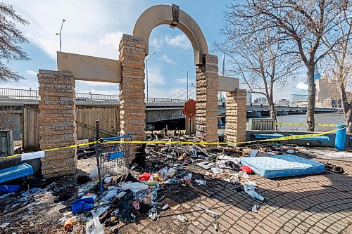 MIKE DEAL / FREE PRESS
The burned out remains of an encampment at the Joseph Royal Park off of Tache Avenue next to the Provencher Bridge on Wednesday.
Reporter: Malak Abas
260415 - Wednesday, April 15, 2026.