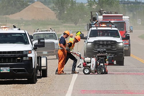 09062026
Workers with the province create new rumble strips on Manitoba Highway 110 north of Richmond Avenue on Tuesday as simultaneous work is done on the traffic light system at the intersection of Richmond Avenue and Manitoba Highway 110. 
(Tim Smith/The Brandon Sun)