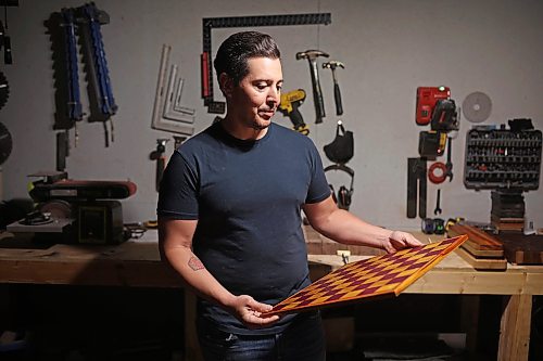 09062026
Jonathan Paddison, owner of Northern Prairie Woodworks, looks over a custom chess board he made at his wood shop in Virden on Tuesday. 
(Tim Smith/The Brandon Sun)