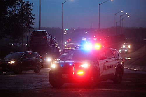 09062026
Brandon Police Service members block the southbound lanes of 18th Street just south of Rosser Avenue after a tree fell blocking the lanes during Tuesday evening’s storm.
(Tim Smith/The Brandon Sun)