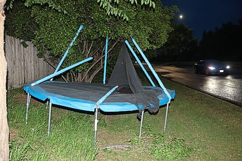 09062026
A damaged trampoline that blew onto 34th Street in Brandon was moved onto grass bordering the road during Tuesday evening’s storm. 
(Tim Smith/The Brandon Sun)