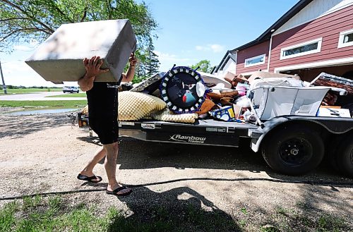 Ruth Bonneville  Free Press

Local Stonewall business flooding 

Matt a Stonewall resident, carries water-damaged furnishing and baby items from his basement to his trailer that will be thrown in the dump.   Flood waters from Tuesday record rainfall filled his families basement in their newly built home.  (No last name provided)

The historic weather event on Tuesday, where tornado warnings, hail, and a record-breaking 250 mm of rainfall battered Stonewall, Balmoral, Winnipeg, and surrounding regions, causing major overland flooding and sewer backups causing  significant property and residential damage.

See story by Malak

June 10th, 2026