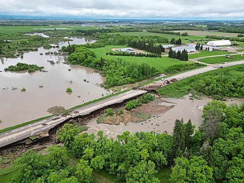 10062026
Damage to Highway 10 at Tamarack Creek just east of Swan River, Manitoba is visible on Wednesday after intense rainfall this week caused the river to swell and damaged the highway. The province cut a section of Highway 10 at the creek to relieve some of the pressure from the swollen creek.
(Tim Smith/The Brandon Sun)
