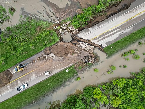 10062026
Damage to Highway 10 at Tamarack Creek just east of Swan River, Manitoba is visible on Wednesday after intense rainfall this week caused the river to swell and damaged the highway. The province cut a section of Highway 10 at the creek to relieve some of the pressure from the swollen creek.
(Tim Smith/The Brandon Sun)