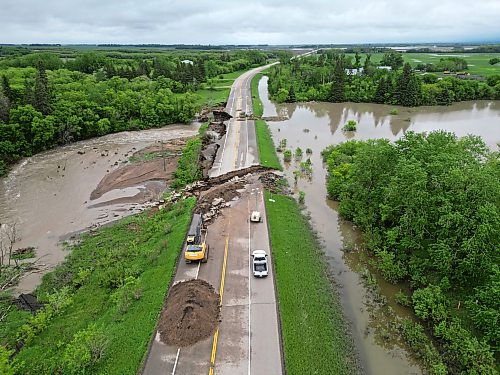 10062026
Damage to Highway 10 at Tamarack Creek just east of Swan River, Manitoba is visible on Wednesday after intense rainfall this week caused the river to swell and damaged the highway. The province cut a section of Highway 10 at the creek to relieve some of the pressure from the swollen creek.
(Tim Smith/The Brandon Sun)
