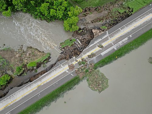 10062026
Damage to Highway 10 at Tamarack Creek just east of Swan River, Manitoba is visible on Wednesday after intense rainfall this week caused the river to swell and damaged the highway. The province cut a section of Highway 10 at the creek to relieve some of the pressure from the swollen creek.
(Tim Smith/The Brandon Sun)