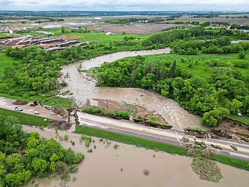10062026
Damage to Highway 10 at Tamarack Creek just east of Swan River, Manitoba is visible on Wednesday after intense rainfall this week caused the river to swell and damaged the highway. The province cut a section of Highway 10 at the creek to relieve some of the pressure from the swollen creek. 
(Tim Smith/The Brandon Sun)
