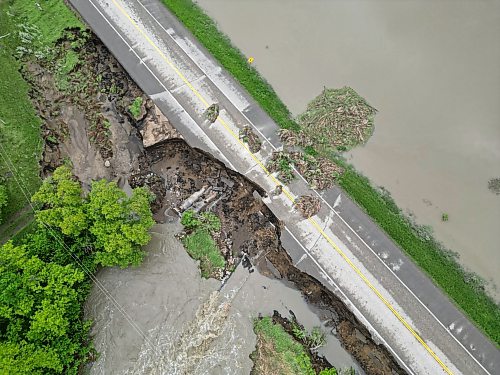 10062026
Damage to Highway 10 at Tamarack Creek just east of Swan River, Manitoba is visible on Wednesday after intense rainfall this week caused the river to swell and damaged the highway. The province cut a section of Highway 10 at the creek to relieve some of the pressure from the swollen creek.
(Tim Smith/The Brandon Sun)