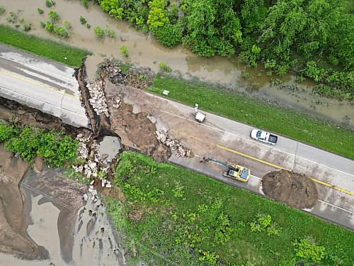 10062026
Damage to Highway 10 at Tamarack Creek just east of Swan River, Manitoba is visible on Wednesday after intense rainfall this week caused the river to swell and damaged the highway. The province cut a section of Highway 10 at the creek to relieve some of the pressure from the swollen creek. 
(Tim Smith/The Brandon Sun)
