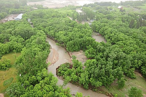 10062026
A swollen creek near Minitonas is visible from a helicopter during rain on Wednesday after intense rainfall this week caused widespread flooding in the region. Manitoba Premier Wab Kinew toured the affected areas Wednesday.
(Tim Smith/The Brandon Sun)