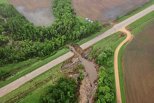 10062026
A damaged portion of Highway 10 between Minitonas and Swan River, Manitoba is visible from a helicopter during rain on Wednesday after intense rainfall this week caused widespread flooding in the region. Manitoba Premier Wab Kinew toured the affected areas Wednesday.
(Tim Smith/The Brandon Sun)