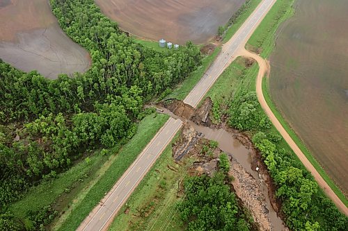 10062026
A damaged portion of Highway 10 between Minitonas and Swan River, Manitoba is visible from a helicopter during rain on Wednesday after intense rainfall this week caused widespread flooding in the region. Manitoba Premier Wab Kinew toured the affected areas Wednesday.
(Tim Smith/The Brandon Sun)