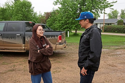 10062026
Manitoba Premier Wab Kinew visits with Minitonas resident Karly Young while visiting the devastated community on Wednesday to see firsthand the damage caused by flooding in the area over the past few days. 
(Tim Smith/The Brandon Sun)
