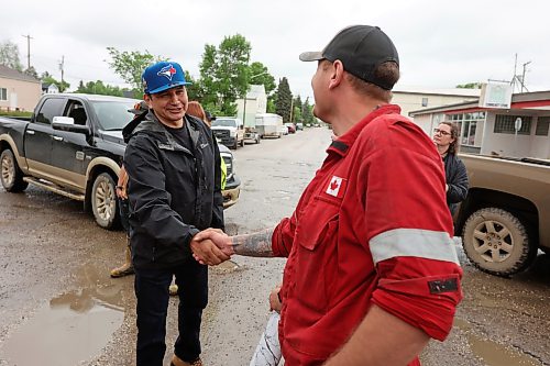 10062026
Manitoba Premier Wab Kinew visits with emergency workers helping out in the community of Minitonas on Wednesday while touring the damage caused by flooding in the area over the past few days. 
(Tim Smith/The Brandon Sun)
