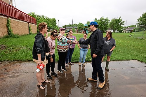 10062026
Manitoba Premier Wab Kinew meets residents of Minitonas and area outside the Minitonas Early Years School on Wednesday while touring the damage caused by flooding in the area over the past few days.
(Tim Smith/The Brandon Sun)