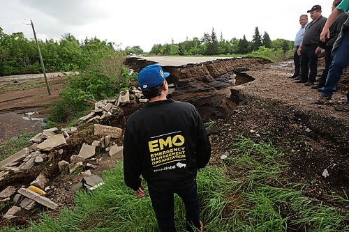 10062026
Manitoba Premier Wab Kinew tours damage to Highway 10 at Tamarack Creek just east of Swan River, Manitoba on Wednesday after intense rainfall this week caused the river to swell and damaged the highway. The province cut a section of Highway 10 at the creek to relieve some of the pressure from the swollen creek.
(Tim Smith/The Brandon Sun)