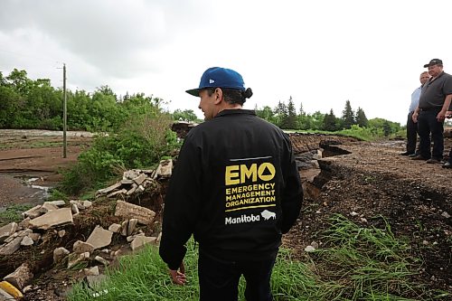 10062026
Manitoba Premier Wab Kinew tours damage to Highway 10 at Tamarack Creek just east of Swan River, Manitoba on Wednesday after intense rainfall this week caused the river to swell and damaged the highway. The province cut a section of Highway 10 at the creek to relieve some of the pressure from the swollen creek.
(Tim Smith/The Brandon Sun)