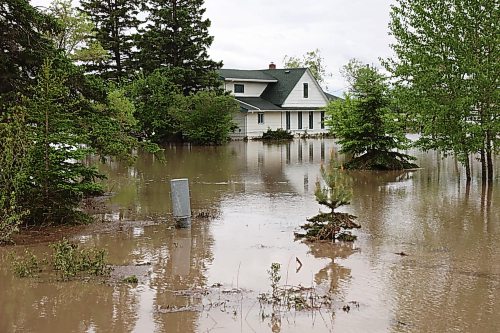 10062026
A home is surrounded by floodwaters along Highway 83 south of Swan River, Manitoba on Wednesday after sustained rainfall earlier in the week caused widespread flooding. (Tim Smith/The Brandon Sun)