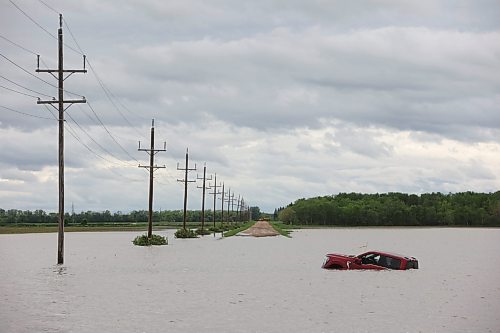 10062026
A pickup trucks sits partially submerged in floodwaters along Highway 83 south of Swan River, Manitoba on Wednesday after sustained rainfall earlier in the week caused widespread flooding. (Tim SmithThe Brandon Sun)