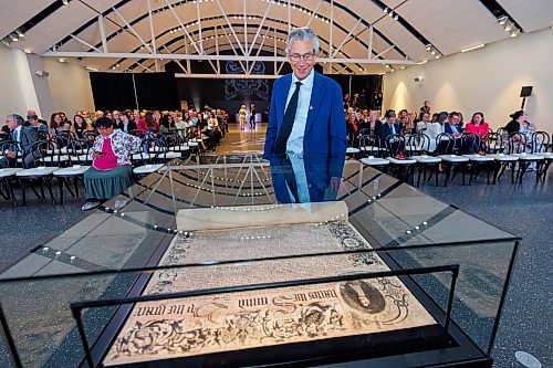 MIKE DEAL / FREE PRESS
Former Premier Gary Doer takes a moment to check out the Charter prior to the start of the HBC Royal Charter Welcoming Ceremony and Reception which was held at the Manitoba Museum Thursday morning.
260611 - Thursday, June 11, 2026.