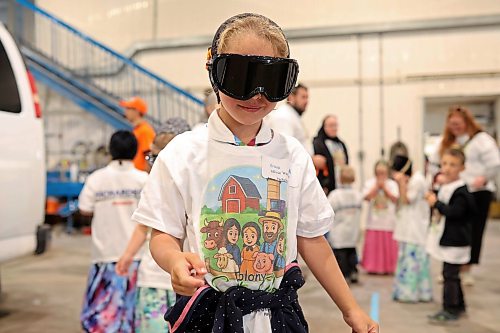 Young Hutterite students try on goggles that mimic different levels of impairment during Colony Safety Day at Rolling Acres Hutterite Colony near Eden on Friday. (Tim Smith/The Brandon Sun)