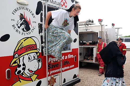 12062026
Students climb out of a fire safety training trailer while learning about fire safety from members of the Eden Fire Department during Colony Safety Day at Rolling Acres Hutterite Colony near Eden, Manitoba on Friday. (Tim Smith/The Brandon Sun)