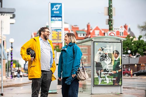 MIKAELA MACKENZIE / FREE PRESS
	
Musician John Samson Fellows and Laura Cameron from Climate Action at an Osborne Village bus stop on Monday, June 15, 2026. John Samson Fellows has released a new song calling on the provincial government to reinstate 50/50 funding for Winnipeg Transit, in support of a public transportation funding campaign led by Climate Action Team Manitoba and the Amalgamated Transit Union.

For Eva story.
Free Press 2026