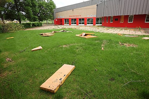 15062026
Debris litters the ground around Sioux Valley Elementary School at Sioux Valley Dakota Nation on Monday in the wake of a storm that tore part of the roof off the school. The school was heavily damaged in a storm on June 6th forcing the cancellation of classes for the approximately 340 students, just a few weeks before the end of the school year. 
(Tim Smith/The Brandon Sun)