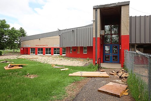 15062026
Debris litters the ground around Sioux Valley Elementary School at Sioux Valley Dakota Nation on Monday in the wake of a storm that tore part of the roof off the school. The school was heavily damaged in a storm on June 6th forcing the cancellation of classes for the approximately 340 students, just a few weeks before the end of the school year. 
(Tim Smith/The Brandon Sun)