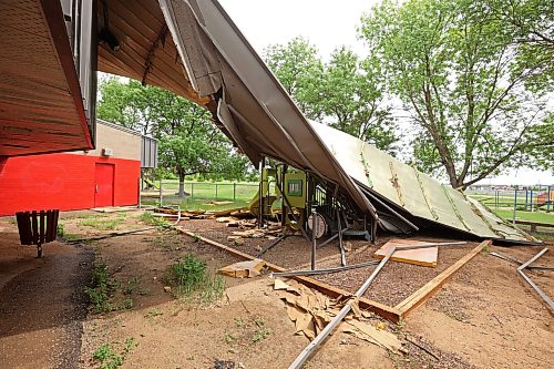 15062026
A portion of the roof of Sioux Valley Elementary School at Sioux Valley Dakota Nation lies on playground equipment along with other debris on Monday. The school was heavily damaged in a storm on June 6th forcing the cancellation of classes for the approximately 340 kindergarten - grade eight students, just a few weeks before the end of the school year. 
(Tim Smith/The Brandon Sun)